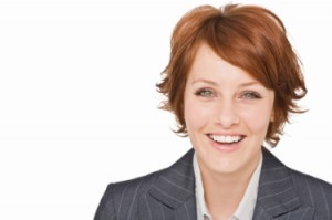 Closeup portrait of a happy young businesswoman isolated on white background